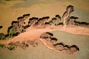 Aerial view of eroded banks and river with suspended load, caused by deforestation Aerial view of eroded banks and river with suspended load, caused by deforestation