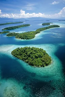 Aerial view of islands with fringing coral reefs, New Georgia, Solomon Islands, Pacific Aerial view of islands with fringing coral reefs, New Georgia, Solomon Islands, Pacific