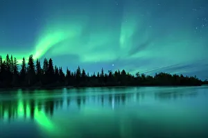 Aurora Borealis (Northern Lights) over the Klondike River, Yukon Territories, Canada Aurora Borealis (Northern Lights) over the Klondike River, Yukon Territories, Canada