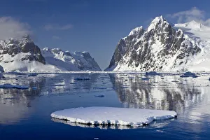 Calm conditions with sea ice in the Lemaire Channel. Antarctic Peninsula, Antarctica, December Calm conditions with sea ice in the Lemaire Channel. Antarctic Peninsula, Antarctica, December