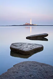 Calm sea with St Marys Lighthouse in distance, Whitley Bay, Tyne and Wear, England Calm sea with St Marys Lighthouse in distance, Whitley Bay, Tyne and Wear, England