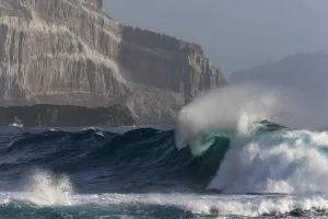 Cliff wall and wave, Guadalupe Island Biosphere Reserve, off the coast of Baja California Cliff wall and wave, Guadalupe Island Biosphere Reserve, off the coast of Baja California