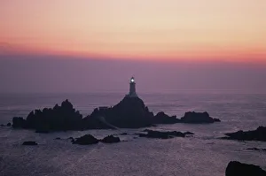 Corbiere lighthouse at sunset, Jersey, Channel Islands Corbiere lighthouse at sunset, Jersey, Channel Islands