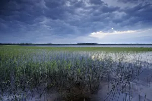 Dark cloudy sky over Lake Usma viewed from Moricsala Island, Moricsala Strict Nature Reserve Dark cloudy sky over Lake Usma viewed from Moricsala Island, Moricsala Strict Nature Reserve