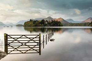 Derwent Water, fence, gate and flooding, looking to Catbells mountain, near Keswick Derwent Water, fence, gate and flooding, looking to Catbells mountain, near Keswick