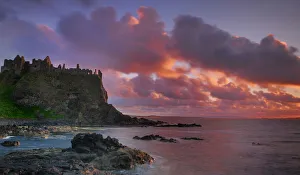 Dunluce Castle at sunset, North Antrim coast, County Antrim, Northern Ireland, UK Dunluce Castle at sunset, North Antrim coast, County Antrim, Northern Ireland, UK