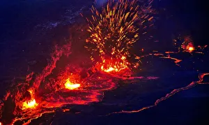 Eruption and molten lava flowing down the sides of the Erta ale volcano (the smoking Eruption and molten lava flowing down the sides of the Erta ale volcano (the smoking