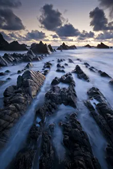 Hartland Quay, rugged north Devon coastline, high tide at sunset, Devon, UK, April 2012 Hartland Quay, rugged north Devon coastline, high tide at sunset, Devon, UK, April 2012