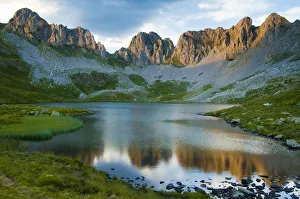 Ibon del Acherito, (Acherito Lake), surrounded by mountain peaks. Anso Valley, Pyrenees Ibon del Acherito, (Acherito Lake), surrounded by mountain peaks. Anso Valley, Pyrenees