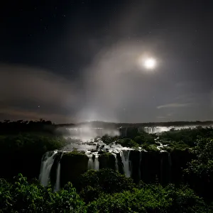 Iguasu Falls by moonlight, on the Iguasu River, Brazil / Argentina border Iguasu Falls by moonlight, on the Iguasu River, Brazil / Argentina border