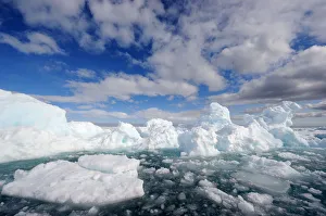Melting ice under expansive clouds. Floe Edge, Arctic Bay, Baffin Island, Nunavut Melting ice under expansive clouds. Floe Edge, Arctic Bay, Baffin Island, Nunavut