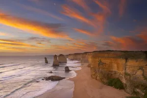 The moon over the eroded coastline of the Twelve Apostles at dusk, Port Campbell National Park The moon over the eroded coastline of the Twelve Apostles at dusk, Port Campbell National Park