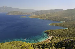 Mourtia beach and bay with the southeast tip of Samos and Mount Mycale in Turkey's Mourtia beach and bay with the southeast tip of Samos and Mount Mycale in Turkey's