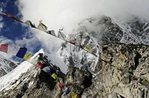 Prayer flags at Pumori Peak (7145 m) seen from Kala Pattar (5545 m), Sagarmatha National Park Prayer flags at Pumori Peak (7145 m) seen from Kala Pattar (5545 m), Sagarmatha National Park