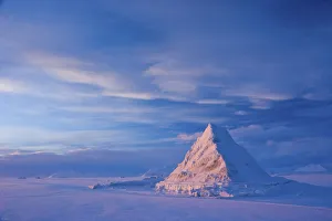 Pyramid of sea ice catching the first rays of the returning sun in the high Arctic Pyramid of sea ice catching the first rays of the returning sun in the high Arctic