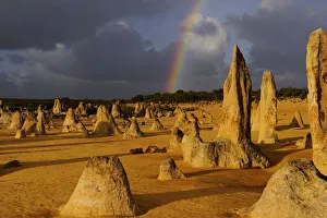Rainbow over the Limestone formations in the Pinnacles desert, Nambung National Park Rainbow over the Limestone formations in the Pinnacles desert, Nambung National Park
