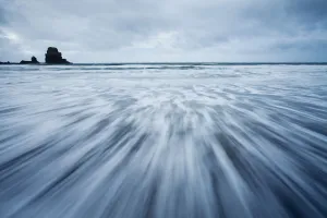 Receding wave shot with long exposure. Talisker Bay, Isle of Skye, Scotland, UK Receding wave shot with long exposure. Talisker Bay, Isle of Skye, Scotland, UK