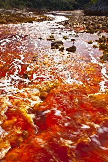 Red waters of the Rio Tinto, coloured by dissolved minerals, primarily iron. Andalusia Red waters of the Rio Tinto, coloured by dissolved minerals, primarily iron. Andalusia