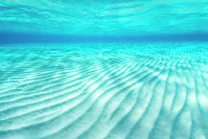 Ripples of sand on a shallow seabed. East End, Grand Cayman, Cayman Islands, British West Indies Ripples of sand on a shallow seabed. East End, Grand Cayman, Cayman Islands, British West Indies