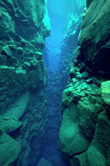 Silfra Canyon - deep fault filled with fresh water in the rift valley between the Eurasian Silfra Canyon - deep fault filled with fresh water in the rift valley between the Eurasian