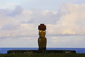 Silhouette of Moai statue at dawn in Ahu Ko Te Riku, restored archaeological site of Ahu Tahai Silhouette of Moai statue at dawn in Ahu Ko Te Riku, restored archaeological site of Ahu Tahai