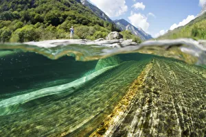 Split level view of blue green waters of Verzasca River flowing over granite rocks at Lavertezzo Split level view of blue green waters of Verzasca River flowing over granite rocks at Lavertezzo