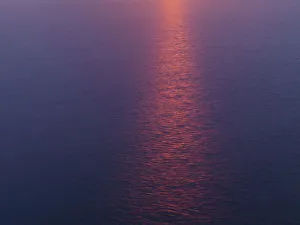 Sun reflected in sea at sunset, viewed from the Cliffs of Moher, The Burrren, County Clare Sun reflected in sea at sunset, viewed from the Cliffs of Moher, The Burrren, County Clare