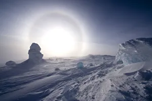 Sundog / Parhelion (circle of light around the sun) with large ice fumerole in the foreground Sundog / Parhelion (circle of light around the sun) with large ice fumerole in the foreground