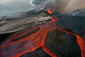 Tolbachik Volcano erupting with lava flowing down the mountain side. Kamchatka, Russia Tolbachik Volcano erupting with lava flowing down the mountain side. Kamchatka, Russia