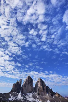 Tre Cime di Lavaredo mountains with clouds in the sky, Sexten Dolomites, South Tyrol Tre Cime di Lavaredo mountains with clouds in the sky, Sexten Dolomites, South Tyrol