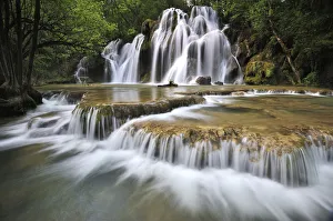 Water flowing over the Cascade des Tufs aux Planches, Arbois, Franche-Comte, France Water flowing over the Cascade des Tufs aux Planches, Arbois, Franche-Comte, France