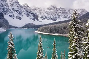 Wenkchemna Peaks or Ten Peaks rising over Moraine lake in the snow, near Lake Louise Wenkchemna Peaks or Ten Peaks rising over Moraine lake in the snow, near Lake Louise