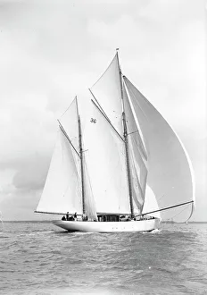 Prints of The 105 ft ketch Thendara sailing with spinnaker. 1939. Thendara was designed by Alfred Mylne for the Scottish yachtsman Sir Arthur Young. She was launched in 1937 and is still racing today Isle Of Wight Prints: The 105 ft ketch Thendara sailing with spinnaker. 1939 Print