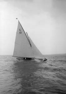 Classic Sailboat Design Prints: The 6 Metre Ejnar breaking waves, 1912. Creator: Kirk & Sons of Cowes