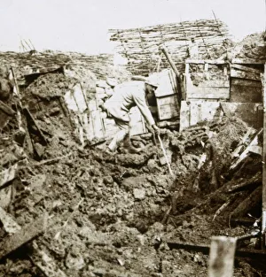 WWI Black And White Pictures Prints: Aftermath of a shell, a soldier in the crater, c1914-c1918