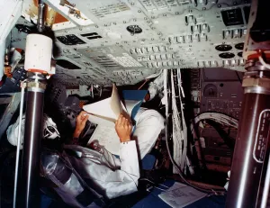 Manned Spaceflight History Prints: An astronaut inside a NASA Command Module, 1970s. Artist: NASA