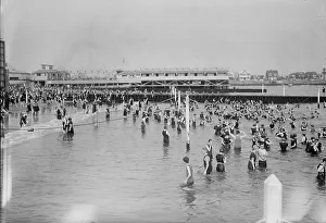 Vintage Swimming Costumes Prints: Bathing at Brighton Beach, between c1910 and c1915. Creator: Bain News Service