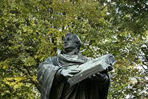Martin Luther Prints: Print of a bronze statue depicting Martin Luther holding an open Bible