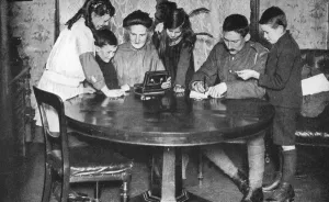 Children emptying their money boxes to invest in war bonds, 1936 Children emptying their money boxes to invest in war bonds, 1936