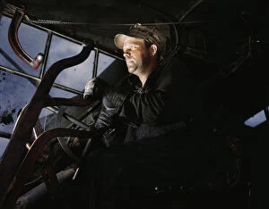 Alfred Palmer Collection: Crane operator at TVAs Douglas Dam, Tennessee, 1942. Creator: Alfred T Palmer