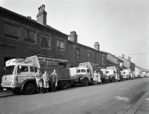 Prints of Fleet of soft drinks delivery lorries, Mexborough, South Yorkshire, 1961. The fleet of lorries with their newest Bedford TK at the front of the line up Pop Art Prints: Fleet of Soft Drinks Delivery Lorries, Mexborough, 1961 Print