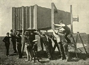 Antique Photography Equipment Prints: Focussing The Gigantic Camera For Work, 1901. Creator: Unknown
