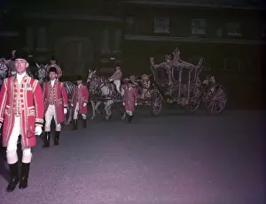Prints of The Gold State Coach, Royal Mews, London, 1953. Press call in the lead-up to the coronation, with postilions, Royal Household footmen/officials in livery, and Windsor Grey horses Westminster Prints: The Gold State Coach Print, a photograph of the coach in 1953