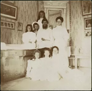 Alix Of Hesse Collection: Grigory Rasputin with Empress Alexandra Fyodorovna, her five children and seated right governess Mar