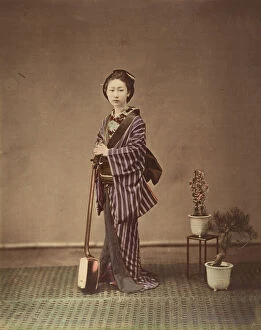 Albumen Silver Print From Glass Negative With Applied Colour Collection: [Japanese Woman in Traditional Dress Posing with Instrument], 1870s. Creator: Unknown