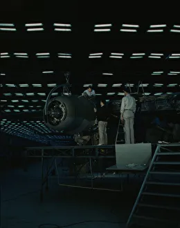 Second World War Aviation History Prints: Lowering an engine in place in assembling