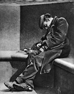 Wonderful London Publication Prints: A man sleeping on Blackfriars Bridge, London, 1926-1927. Artist: Walter Benington