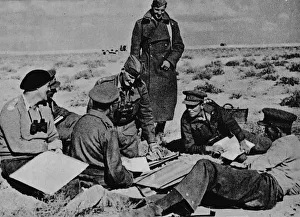 Maps and plans are spread on the sand, 1942 (1944) Maps and plans are spread on the sand, 1942 (1944)