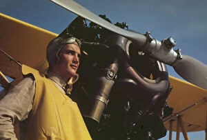 Alfred Palmer Collection: Marine lieutenant by the power plane which tows... at Page Field, Parris, Island, S.C. 1942