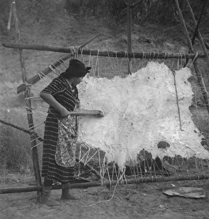Female Artisan At Work Prints: Method of scraping hide for softening